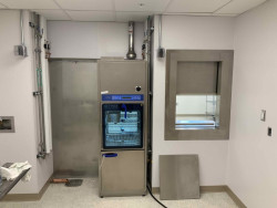 The maintenance side of a second CRD340 Manual Pass-through Window being installed in the same hospital. Gallery